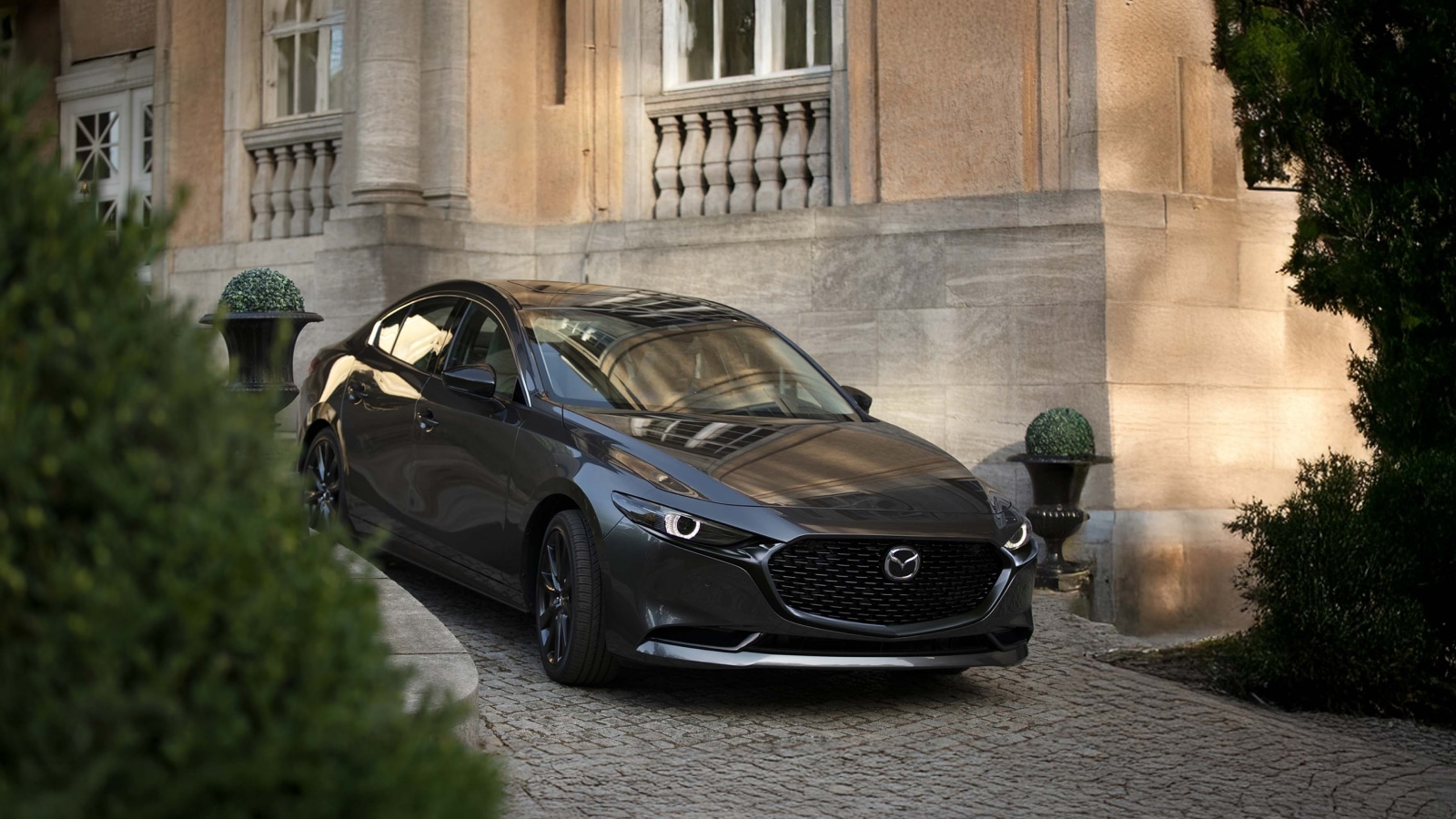 A parked 2026 Mazda3 Sedan on an incline