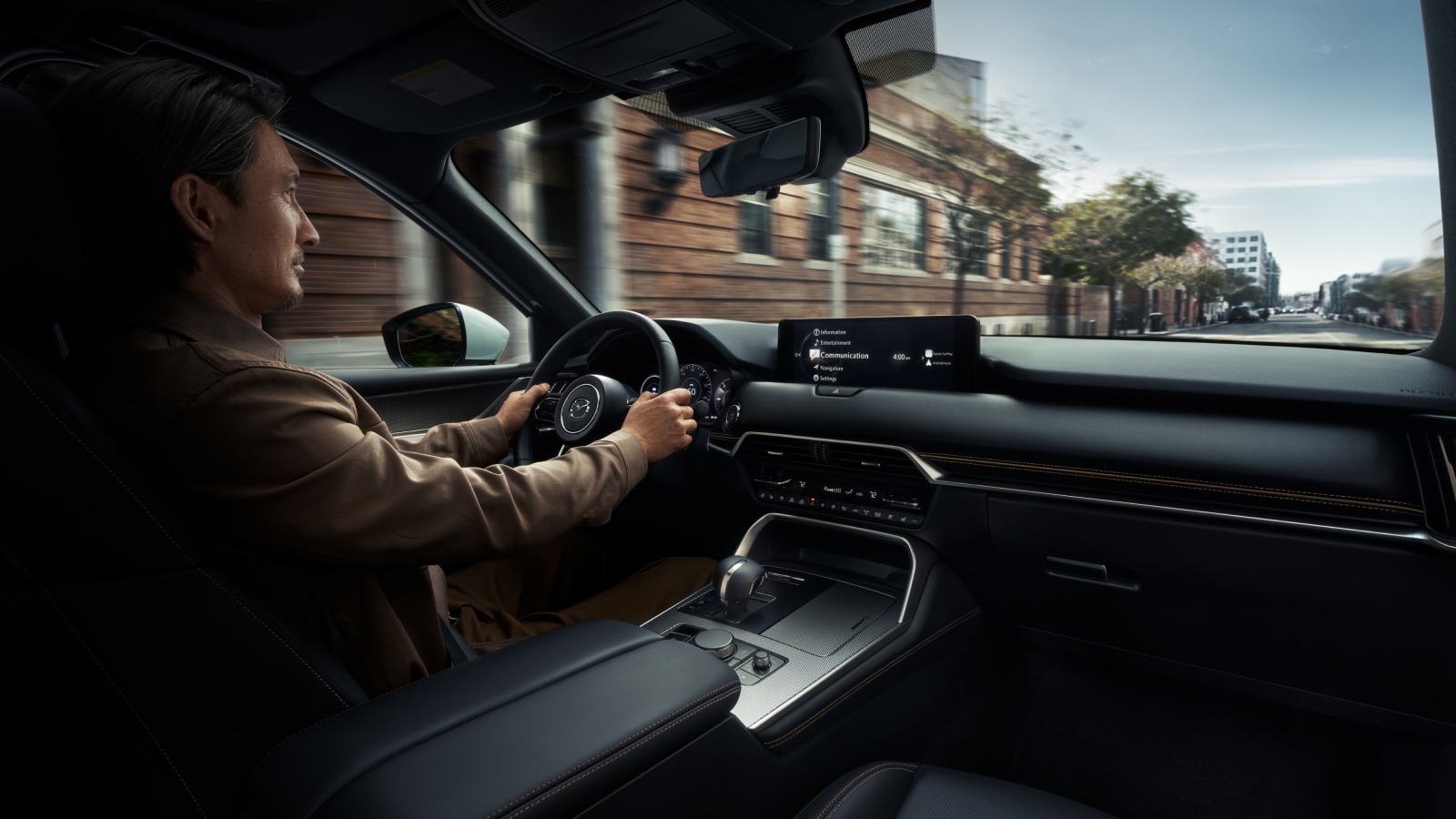 A man driving the 2026 Mazda CX-90