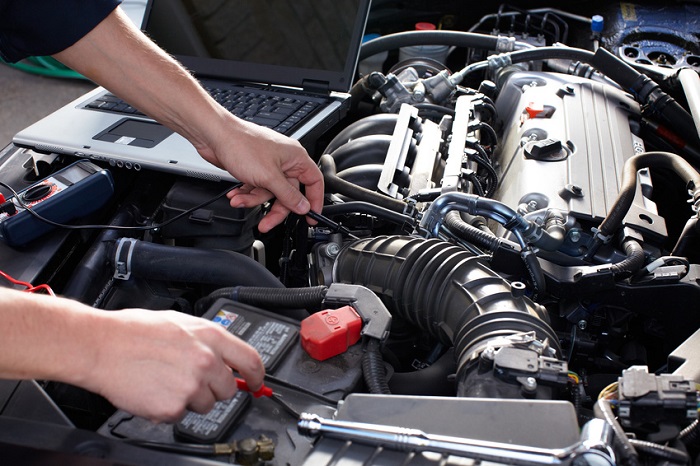Inspecting car as part of a Mazda service schedule