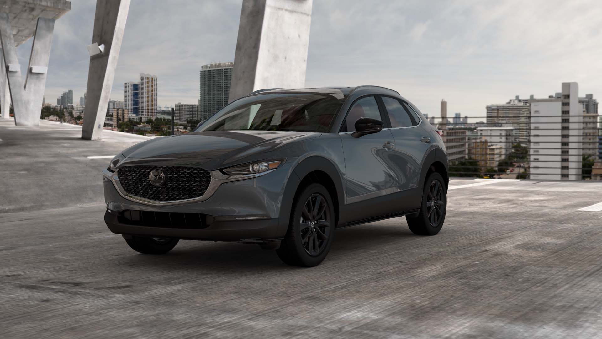 A pre-owned Mazda SUV parked in the city