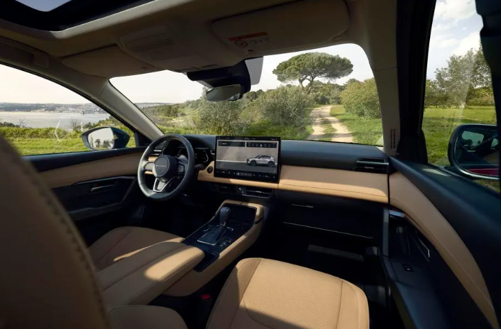 Interior of a 2026 Mazda CX-5 SUV with tan seats and touchscreen display at Middletown Mazda in Middletown.