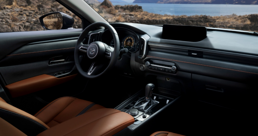 2026 Mazda CX-50 interior with brown leather seats, cockpit and center console